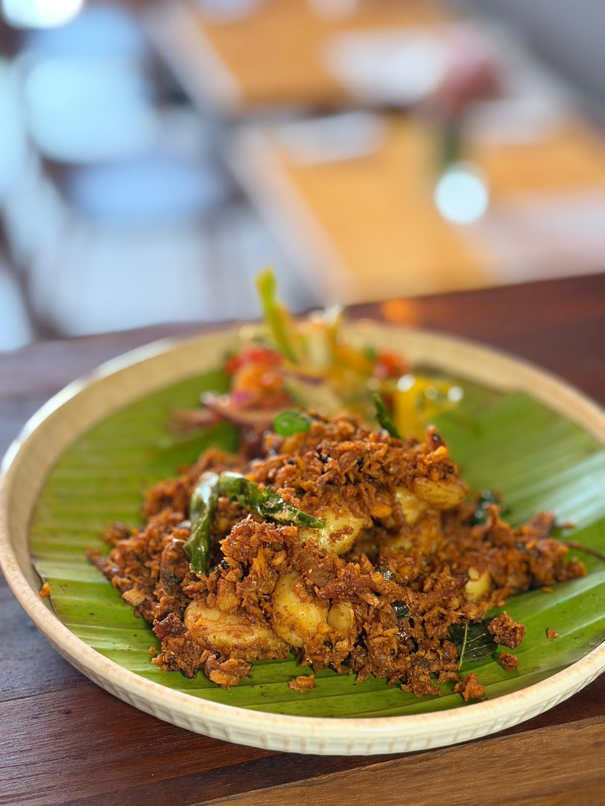 Kerala coconut prawns served on a banana leaf